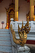 Luang Prabang, Laos - Wat Nong Sikhunmuang, the staircases on either side of the temple are adorned with naga balustrades.  